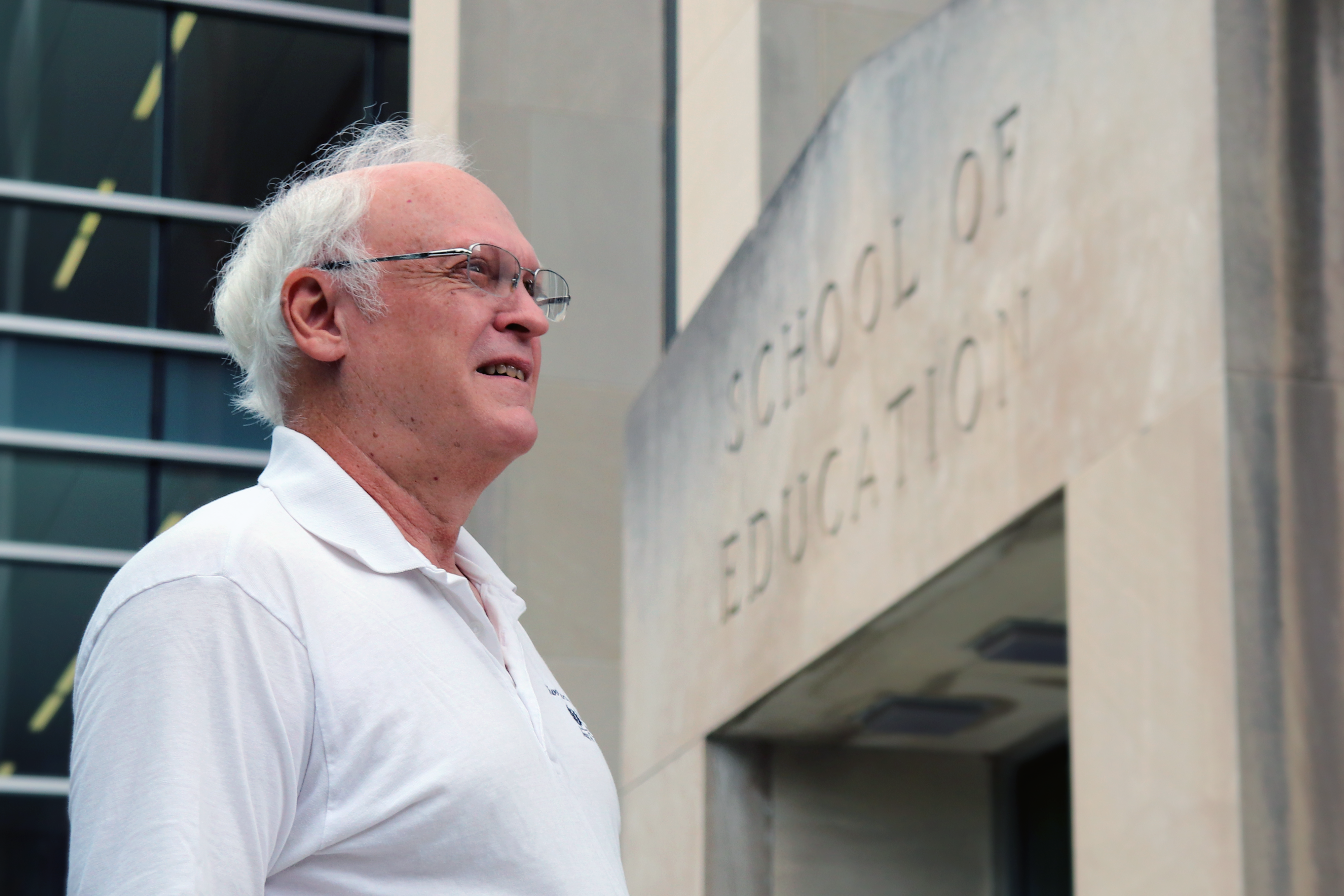 Dr. Michael F. Young stands outside the Gentry building